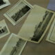 old photographs scattered on a desk